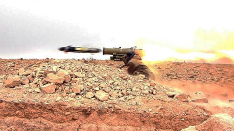 A gunman firing an anti-tank missile at Syrian troops north of Palmyra city, in Homs Provence, Syria. (Photo: AP) A gunman firing an anti-tank missile at Syrian troops north of Palmyra city, in Homs Provence, Syria. (Photo: AP)
