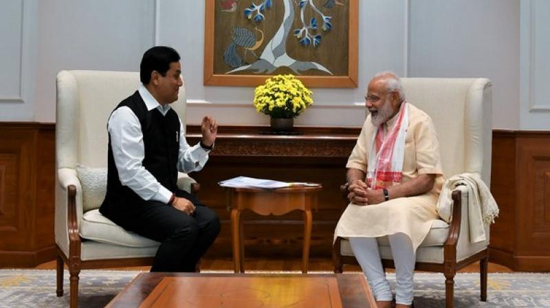 Chief Minister of Assam, Sabanand Sonwal with Prime Minister Narendra Modi on Wednesday in New Delhi. (Photo: Twitter | @PMOIndia) Chief Minister of Assam, Sabanand Sonwal with Prime Minister Narendra Modi on Wednesday in New Delhi. (Photo: Twitter | @PMOIndia)