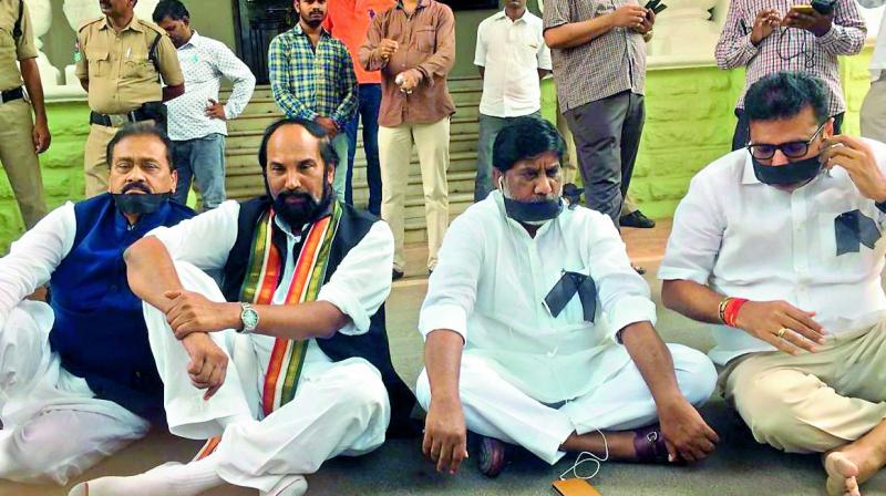 TPCC chief N. Uttam Kumar Reddy, CLP leader Mallu Batti Vikramarka, MLA Sridar Babau and former MLA Shabbir Ali protest near Mahatma Gandhi statue in the Assembly premises on Thursday. TPCC chief N. Uttam Kumar Reddy, CLP leader Mallu Batti Vikramarka, MLA Sridar Babau and former MLA Shabbir Ali protest near Mahatma Gandhi statue in the Assembly premises on Thursday.