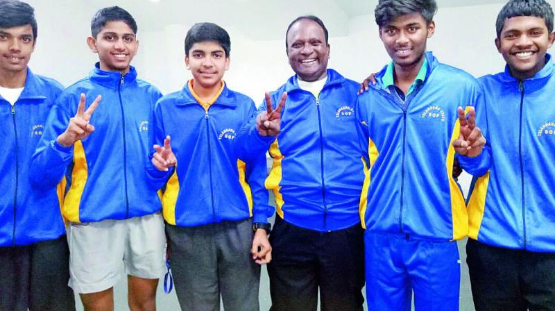 Members of the Telangana Under 19 boys table tennis team flash victory signs after winning a silver medal at the National School Games championships held in New Delhi. Members of the Telangana Under 19 boys table tennis team flash victory signs after winning a silver medal at the National School Games championships held in New Delhi.
