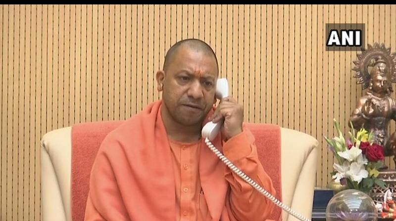 After being denied permission to land a chopper in West Bengal, Uttar Pradesh Chief Minister Yogi Adityanath on Sunday addressed a rally in Raiganj in Dinajpur district over the phone. (Photo: ANI) After being denied permission to land a chopper in West Bengal, Uttar Pradesh Chief Minister Yogi Adityanath on Sunday addressed a rally in Raiganj in Dinajpur district over the phone. (Photo: ANI)