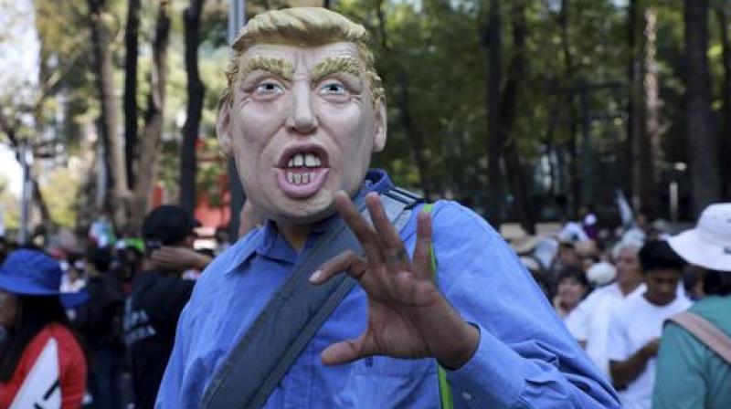 A man wears a mask depicting U.S. President Donald Trump during a march demanding respect for Mexico and its migrants, in the face of perceived hostility from the Trump administration, in Mexico City. (Photo: AP) A man wears a mask depicting U.S. President Donald Trump during a march demanding respect for Mexico and its migrants, in the face of perceived hostility from the Trump administration, in Mexico City. (Photo: AP)