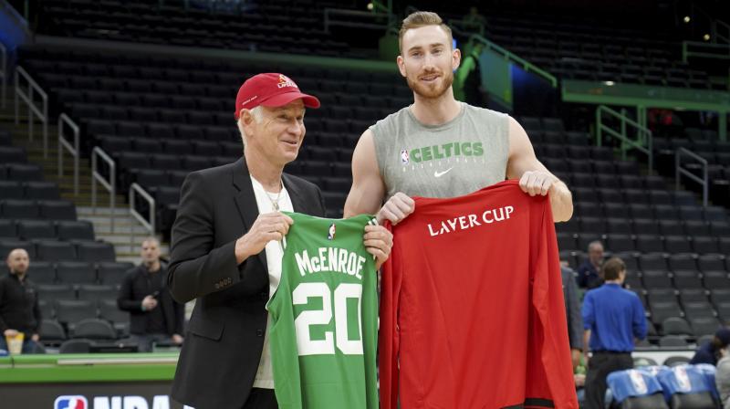 John McEnroe, captain of Team World for the Laver Cup, trades jersey with Boston Celtics' forward Gordon Hayward before a game against the Nrooklyn Nets in Boston on Tuesday. AP Photo John McEnroe, captain of Team World for the Laver Cup, trades jersey with Boston Celtics' forward Gordon Hayward before a game against the Nrooklyn Nets in Boston on Tuesday. AP Photo