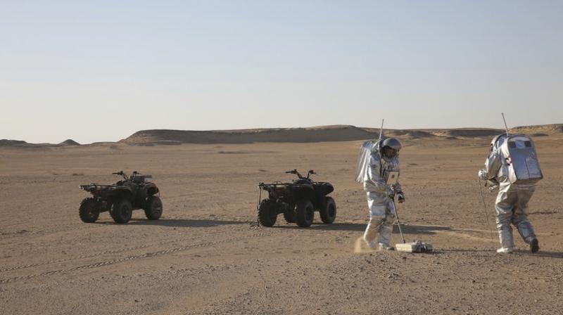 This photo shows two scientists test space suits and a geo-radar for use in a future Mars mission in the Dhofar desert of southern Oman. The desolate desert in southern Oman resembles Mars so much that more than 200 scientists from 25 nations organized by the Austrian Space Forum are using it for the next four weeks to field-test technology for a manned mission to Mars. (Photo: AP) This photo shows two scientists test space suits and a geo-radar for use in a future Mars mission in the Dhofar desert of southern Oman. The desolate desert in southern Oman resembles Mars so much that more than 200 scientists from 25 nations organized by the Austrian Space Forum are using it for the next four weeks to field-test technology for a manned mission to Mars. (Photo: AP)
