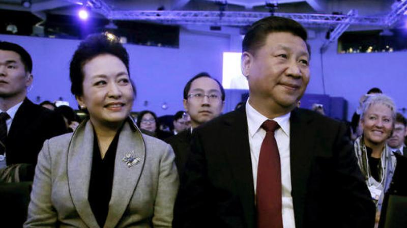 China's President Xi Jinping and his wife Peng Liyuan during the opening session of the World Economic Forum in Davos, Switzerland. (Photo: AP) China's President Xi Jinping and his wife Peng Liyuan during the opening session of the World Economic Forum in Davos, Switzerland. (Photo: AP)