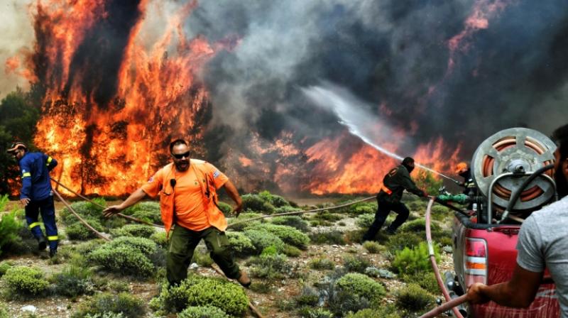Hundreds of firefighters, as well as several aircraft and helicopters have been mobilised to fight the fires in Greece. (Photo: AFP) Hundreds of firefighters, as well as several aircraft and helicopters have been mobilised to fight the fires in Greece. (Photo: AFP)