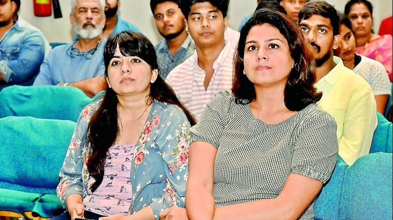 Photography enthusiasts attending artist talks at the Indian Photography Festival Photography enthusiasts attending artist talks at the Indian Photography Festival
