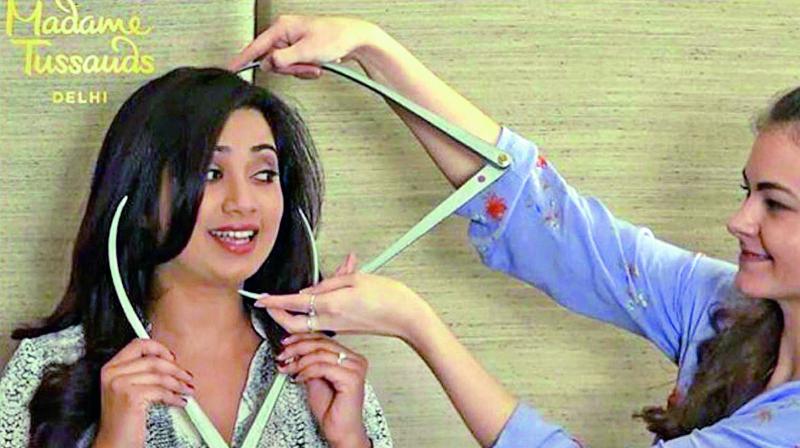 Shreya Ghoshal’s measurements being taken for her wax statue Shreya Ghoshal’s measurements being taken for her wax statue