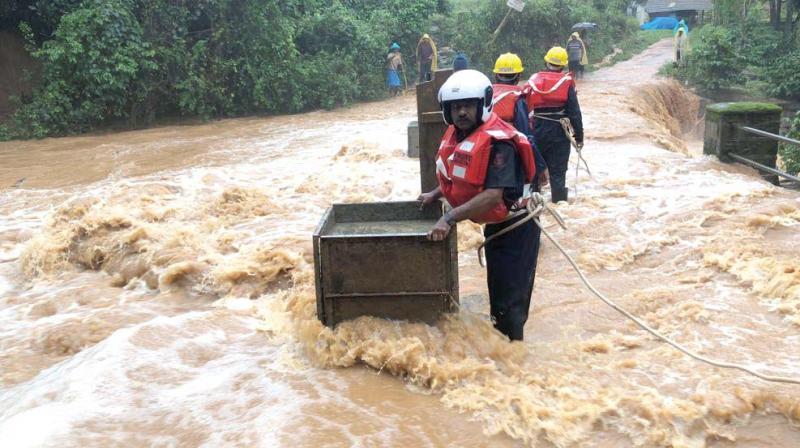 Quick Response Team (QRT) carrying out rescue operations in flood hit areas of Kodagu district.(Image Dc) Quick Response Team (QRT) carrying out rescue operations in flood hit areas of Kodagu district.(Image Dc)