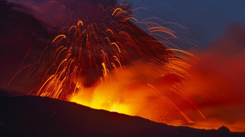 Etna began a new phase of eruptions on Thursday as new cracks in the volcano opened up, sending lava down its flank. (Photo: AP) Etna began a new phase of eruptions on Thursday as new cracks in the volcano opened up, sending lava down its flank. (Photo: AP)
