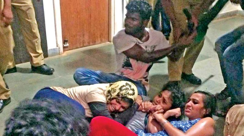 Protesting students being dragged away by cops. (Photo: DC) Protesting students being dragged away by cops. (Photo: DC)