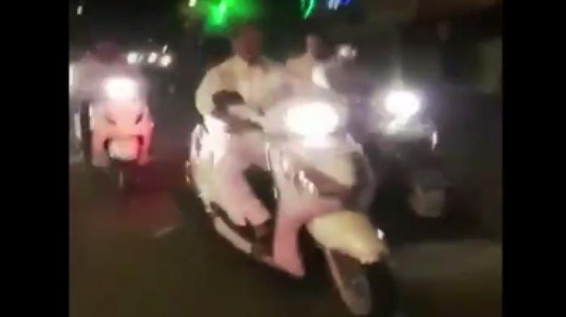 In the video, Bharatiya Janata Party's (BJP's) Das is seen driving a two wheeler without helmet. (Photo: ANI/Screengrab) In the video, Bharatiya Janata Party's (BJP's) Das is seen driving a two wheeler without helmet. (Photo: ANI/Screengrab)