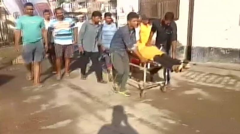 The three assailants brandishing firearms attacked RSS worker Rajesh Mishra, who is also a journalist, when he and his brother were sitting in their building material shop in Brahmanpura Chatti on Saturday morning. (Photo: ANI/Twitter) The three assailants brandishing firearms attacked RSS worker Rajesh Mishra, who is also a journalist, when he and his brother were sitting in their building material shop in Brahmanpura Chatti on Saturday morning. (Photo: ANI/Twitter)