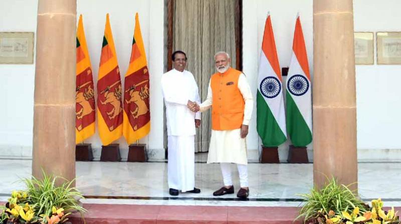Prime Minister Narendra Modi meets up with Sri Lankan President Maithripala Sirisena. (Photo: ANI) Prime Minister Narendra Modi meets up with Sri Lankan President Maithripala Sirisena. (Photo: ANI)