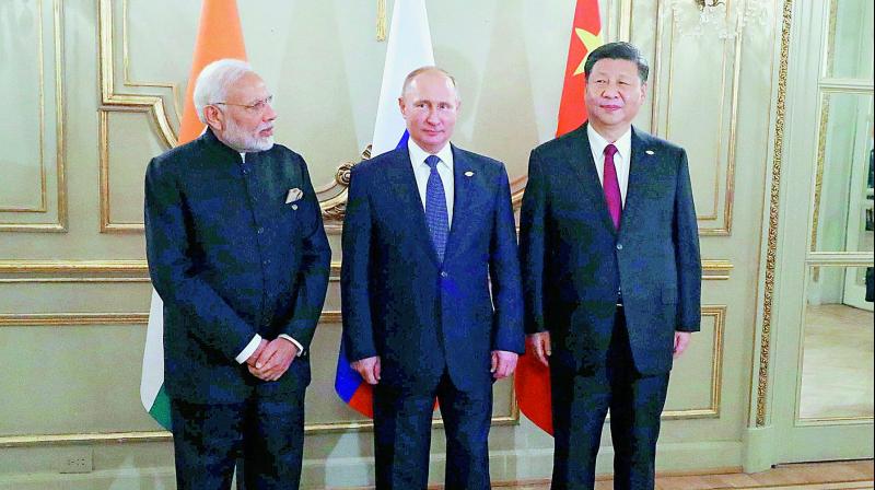 Prime Minister Narendra Modi, left, Russian President Vladimir Putin, center, and Chinese President Xi Jinping, during their meeting at the G20 summit in Buenos Aires, Argentina. (AP/PTI) Prime Minister Narendra Modi, left, Russian President Vladimir Putin, center, and Chinese President Xi Jinping, during their meeting at the G20 summit in Buenos Aires, Argentina. (AP/PTI)