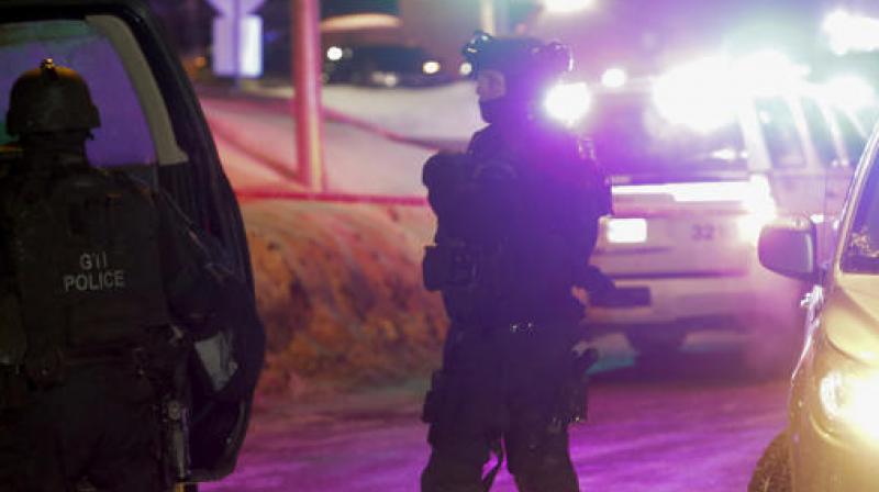 Police survey the scene after a deadly shooting at a mosque in Quebec City, Canada. (Photo: AP) Police survey the scene after a deadly shooting at a mosque in Quebec City, Canada. (Photo: AP)