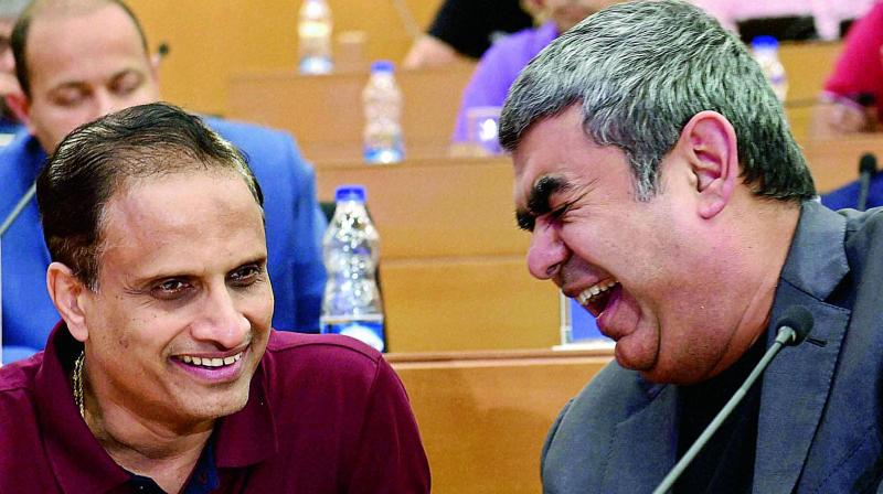 Infosys CEO Vishal Sikka (right) with COO Pravin Rao during the announcement of the second quarter financial results of the company at its headquarter in Bengaluru on Friday. (Photo: AP0 Infosys CEO Vishal Sikka (right) with COO Pravin Rao during the announcement of the second quarter financial results of the company at its headquarter in Bengaluru on Friday. (Photo: AP0