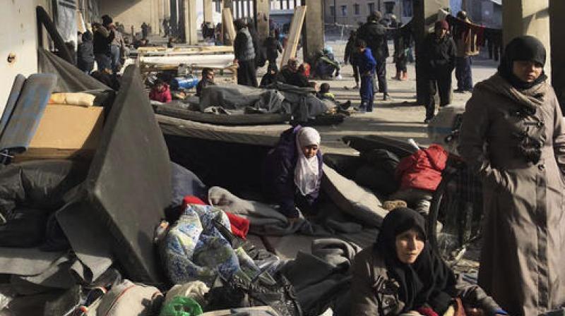 This image released by the International Committee for the Red Cross (ICRC) shows Syrians who were displaced with their families from eastern Aleppo gather at the collective shelter, in the village of Jibreen south of Aleppo, Syria. (Photo: AP) This image released by the International Committee for the Red Cross (ICRC) shows Syrians who were displaced with their families from eastern Aleppo gather at the collective shelter, in the village of Jibreen south of Aleppo, Syria. (Photo: AP)