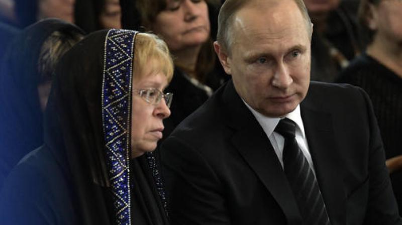 Vladimir Putin Russian President Vladimir Putin, right, speaks to the widow of Russian Ambassador to Turkey Andrei Karlov, Marina during a farewell ceremony at the Foreign Ministry headquarters in Moscow, Russia. (Photo: AP) Vladimir Putin Russian President Vladimir Putin, right, speaks to the widow of Russian Ambassador to Turkey Andrei Karlov, Marina during a farewell ceremony at the Foreign Ministry headquarters in Moscow, Russia. (Photo: AP)