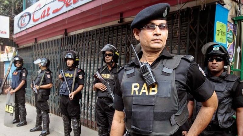 Police said three people are seen in the video. Two appeared to slit the throat of Shikder, 28, after holding him down. (Photo: AP) Police said three people are seen in the video. Two appeared to slit the throat of Shikder, 28, after holding him down. (Photo: AP)