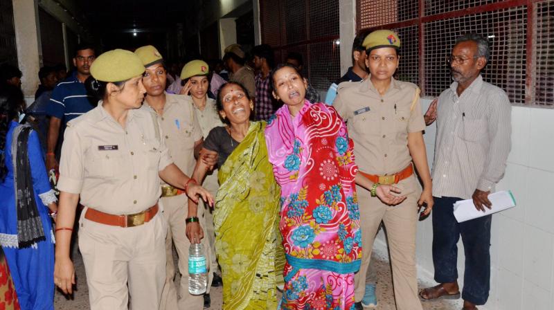 Family members and relatives mourn outside the BRD Hospital in Gorakhpur on Friday where at least 30 children died since the past two days, allegedly due to oxygen supply cut. (Photo: PTI) Family members and relatives mourn outside the BRD Hospital in Gorakhpur on Friday where at least 30 children died since the past two days, allegedly due to oxygen supply cut. (Photo: PTI)