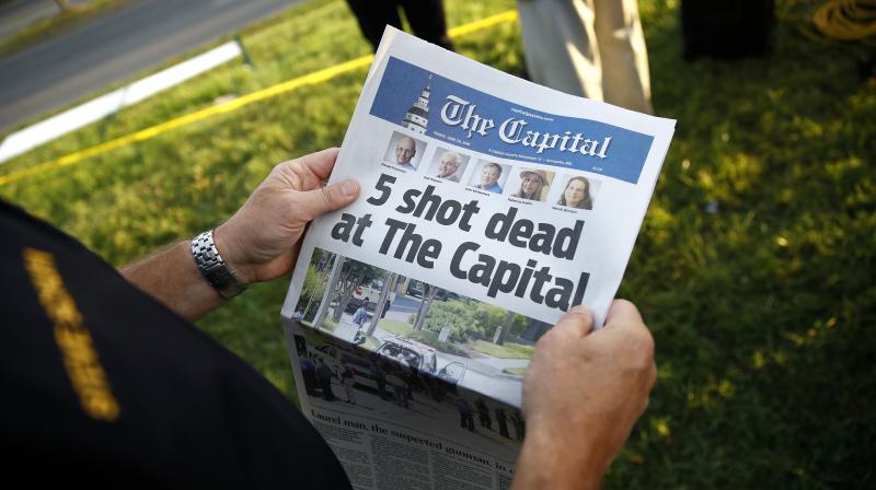Inside, among the paper's blanket coverage of its own tragedy, were profiles of the five staffers gunned down in the latest spasm of America's epidemic of gun violence. (Photo: AP) Inside, among the paper's blanket coverage of its own tragedy, were profiles of the five staffers gunned down in the latest spasm of America's epidemic of gun violence. (Photo: AP)