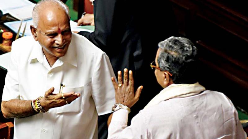 Chief Minister B.S. Yediyurappa and senior Congress leader Siddaramaiah in the Assembly on Monday. (Photo: DC) Chief Minister B.S. Yediyurappa and senior Congress leader Siddaramaiah in the Assembly on Monday. (Photo: DC)