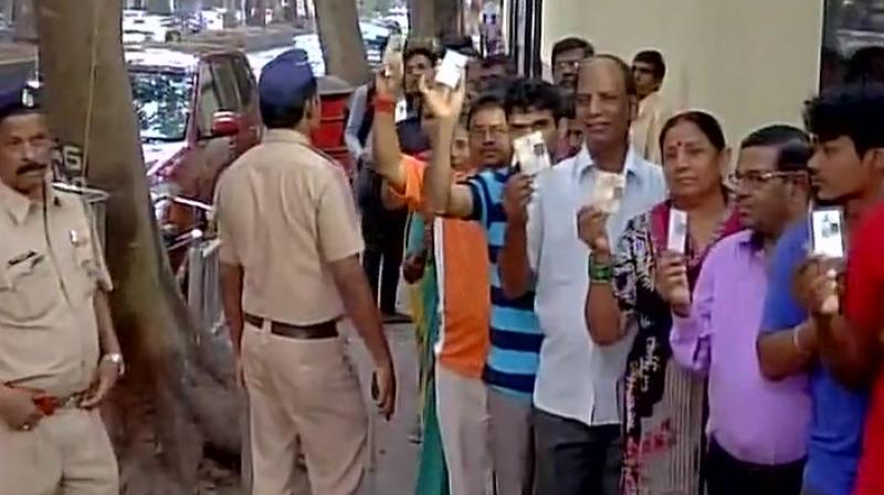 Dubbed as a "mini Assembly election", over 1.95 crore voters across the state are entitled to exercise their franchise to choose representatives for ten city corporations. (Photo: ANI Twitter) Dubbed as a "mini Assembly election", over 1.95 crore voters across the state are entitled to exercise their franchise to choose representatives for ten city corporations. (Photo: ANI Twitter)