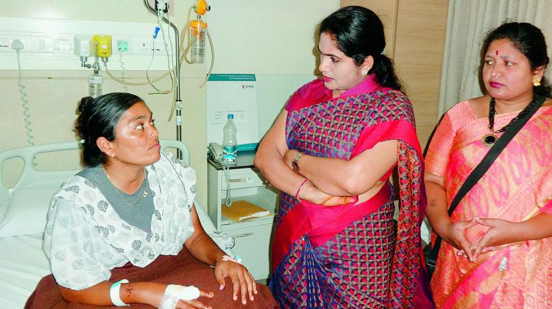 BJP Mahila leaders visit Forest Range Officer (FRO) C. Anitha who is being treated at KIMS hospital after being beaten up by TRS leaders. (Photo: DC) BJP Mahila leaders visit Forest Range Officer (FRO) C. Anitha who is being treated at KIMS hospital after being beaten up by TRS leaders. (Photo: DC)