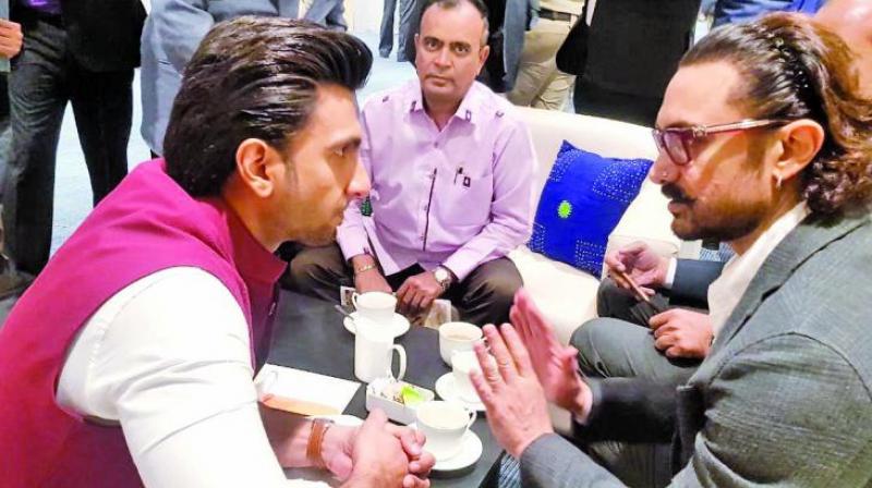 There were further conjectures made about how Ranveer was being replaced by Aamir as the brand ambassador of the event There were further conjectures made about how Ranveer was being replaced by Aamir as the brand ambassador of the event