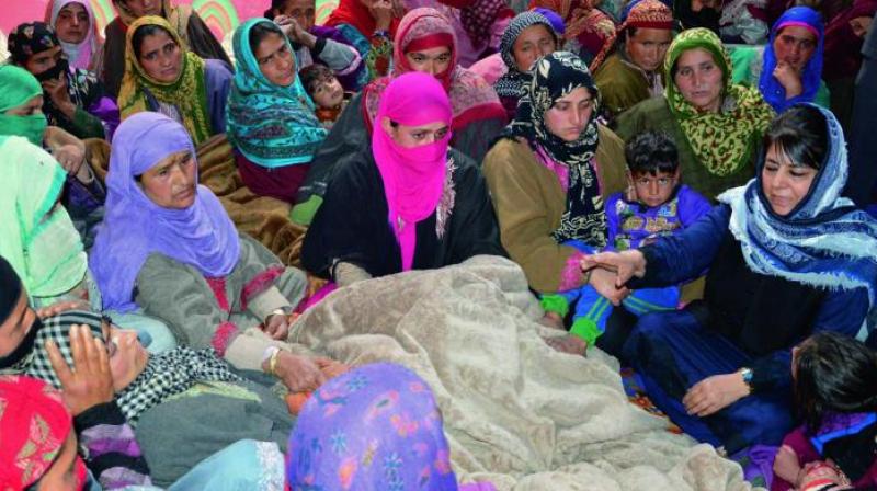 J&K chief minister Mehbooba Mufti visits the family of J&K Bank employee who was killed by the suspected militants during in Kulgam district of south Kashmir. (Photo: PTI) J&K chief minister Mehbooba Mufti visits the family of J&K Bank employee who was killed by the suspected militants during in Kulgam district of south Kashmir. (Photo: PTI)
