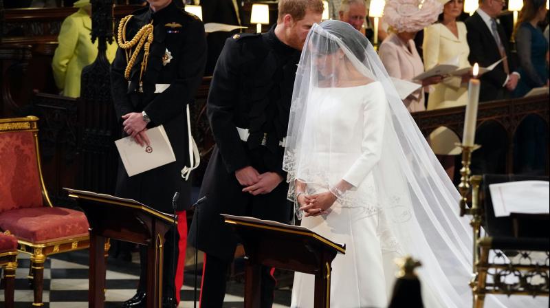 Britain's Prince Harry speaks to his bride, Meghan Markle, during their wedding ceremony at St. George's Chapel in Windsor Castle in Windsor, near London, England, Saturday, May 19, 2018. (Photo: AP) Britain's Prince Harry speaks to his bride, Meghan Markle, during their wedding ceremony at St. George's Chapel in Windsor Castle in Windsor, near London, England, Saturday, May 19, 2018. (Photo: AP)