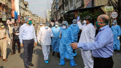 The divisional commissioner of Indore, Akash Tripathi, visits the Taat Patti Bakhal locality where health workers were attacked by local people last week. (PTI)
