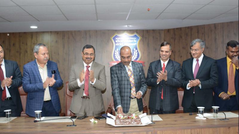 Police Commissioner T. Suneel Kumar cuts a cake to mark the New Year along with additional police commissioners Bijay Kumar Singh, Seemant Kumar Singh, Alok Kumar, Harisekaran, Nanjundaswamy and Sandeep Patil in Bengaluru on Tuesday. Police Commissioner T. Suneel Kumar cuts a cake to mark the New Year along with additional police commissioners Bijay Kumar Singh, Seemant Kumar Singh, Alok Kumar, Harisekaran, Nanjundaswamy and Sandeep Patil in Bengaluru on Tuesday.