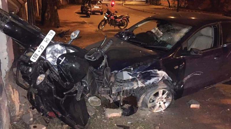 The journalist’s bike is almost nailed to a wall by the car after the mishap. The journalist’s bike is almost nailed to a wall by the car after the mishap.