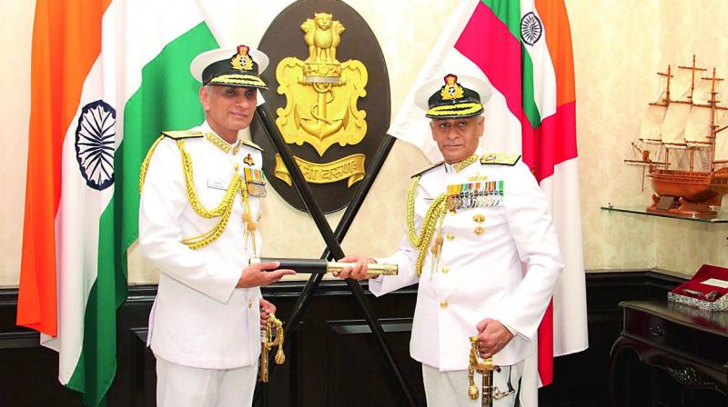 Chief of Naval Staff Admiral Karambir Singh assumes command of the Indian Navy, as his predecessor Sunil Lanba looks on in New Delhi on Friday. Chief of Naval Staff Admiral Karambir Singh assumes command of the Indian Navy, as his predecessor Sunil Lanba looks on in New Delhi on Friday.