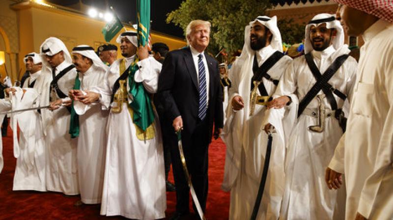 On his first foreign tour as the US President, Donald Trump joined in a traditional sword dance welcome ceremony ahead of a banquet at the Murabba Palace in Saudi Arabia. (Photo: AP) On his first foreign tour as the US President, Donald Trump joined in a traditional sword dance welcome ceremony ahead of a banquet at the Murabba Palace in Saudi Arabia. (Photo: AP)