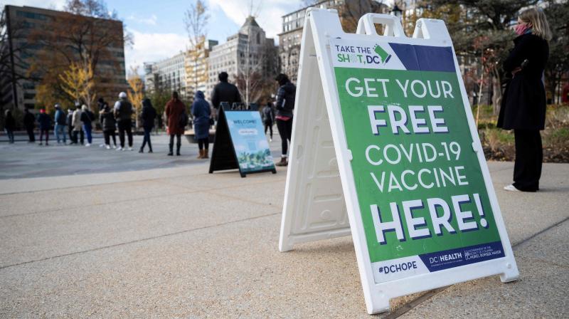 People wait in line to get their Covid-19 vaccination at an outdoor walk-up vaccination site within Franklin Park in Washington, DC. (Photo: AFP)