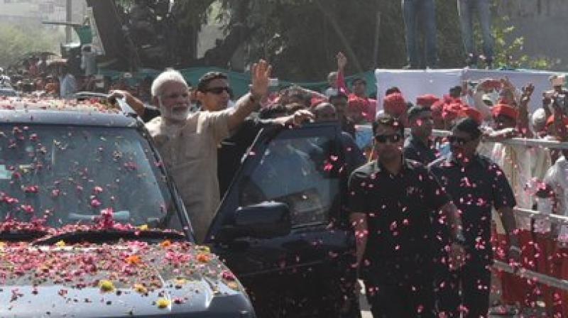 Prime Minister Narendra Modi, on Sunday held a roadshow in Vadnagar, his birthplace, in Mehsana district. (Photo: @PMOIndia/Twitter) Prime Minister Narendra Modi, on Sunday held a roadshow in Vadnagar, his birthplace, in Mehsana district. (Photo: @PMOIndia/Twitter)