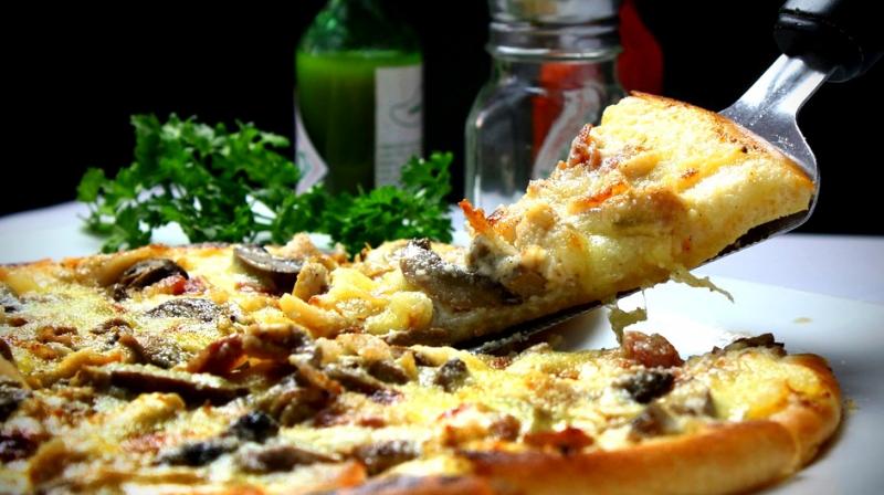 Stretch the dough carefully, preheat a heavy baking stone, and then swiftly slide the topped dough round into a hot oven, making sure the pizza maintains its shape. (Photo: Representational/Pixabay) Stretch the dough carefully, preheat a heavy baking stone, and then swiftly slide the topped dough round into a hot oven, making sure the pizza maintains its shape. (Photo: Representational/Pixabay)