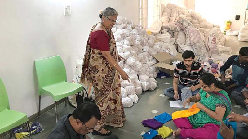 Sudha Murty monitors the packing of relief materials. Sudha Murty monitors the packing of relief materials.