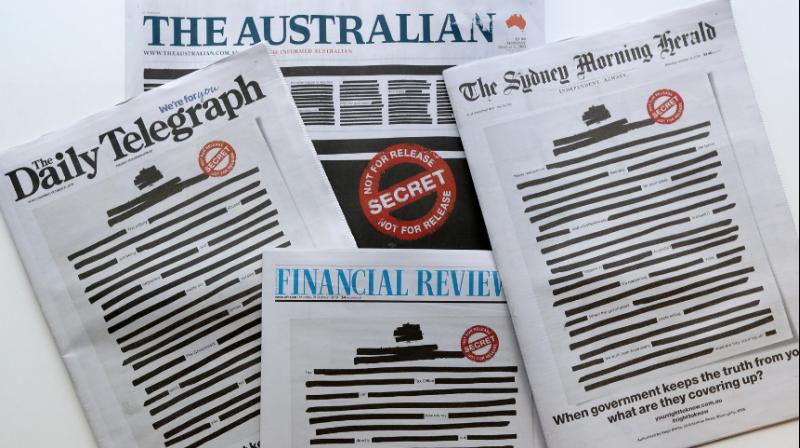 National and regional mastheads including The Australian, The Sydney Morning Herald and the Australian Financial Review hit newsstands Monday with most of their front-page news stories blacked out. (Photo: AP) National and regional mastheads including The Australian, The Sydney Morning Herald and the Australian Financial Review hit newsstands Monday with most of their front-page news stories blacked out. (Photo: AP)