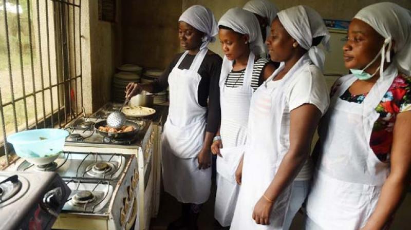 Women learn to cook at Idia Renaissance non-governmental organisation in midwest Nigeria. (Photo: AFP) Women learn to cook at Idia Renaissance non-governmental organisation in midwest Nigeria. (Photo: AFP)
