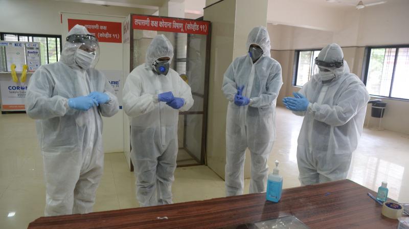 Medical staff wear Personal Protection Equipment (PPE) during a Covid-19 Coronavirus screening at the dedicated Covid facility of the civil hospital.  PTI photo