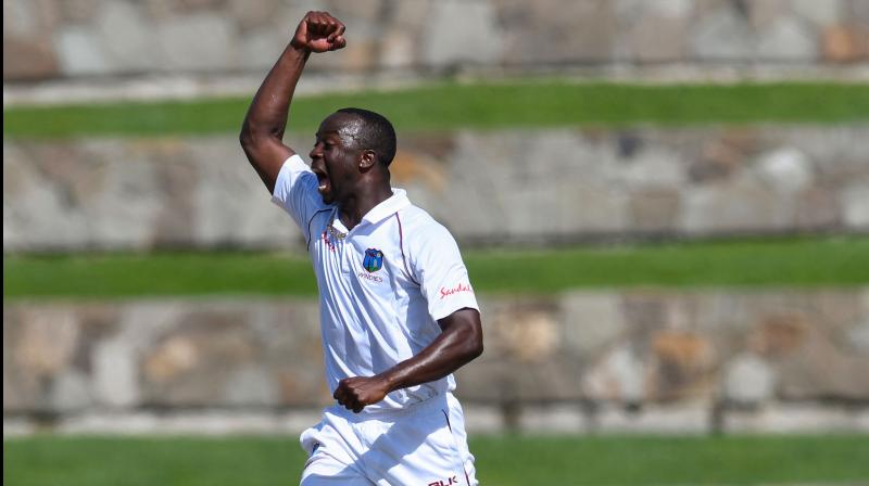 After dismissing opener Mayank Agarwal (5) before lunch on the third day of the second Test, Kemar Roach came out firing on all cylinders and removed KL Rahul and skipper Virat Kohli off successive balls to be on the verge of a hat-trick in India's second innings on Sunday. After dismissing opener Mayank Agarwal (5) before lunch on the third day of the second Test, Kemar Roach came out firing on all cylinders and removed KL Rahul and skipper Virat Kohli off successive balls to be on the verge of a hat-trick in India's second innings on Sunday.