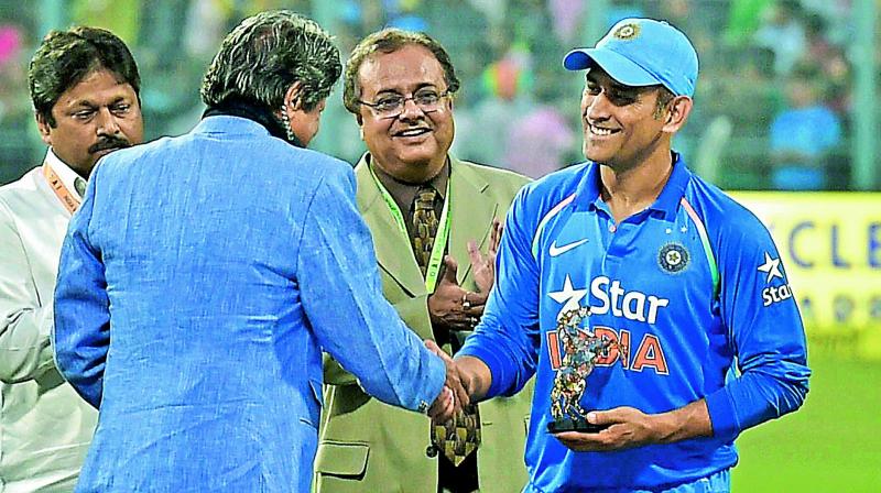 MS Dhoni was felicitated by former India captain Kapil Dev at the Eden Gardens during the innings break of the third one-day match against England. MS Dhoni was felicitated by former India captain Kapil Dev at the Eden Gardens during the innings break of the third one-day match against England.