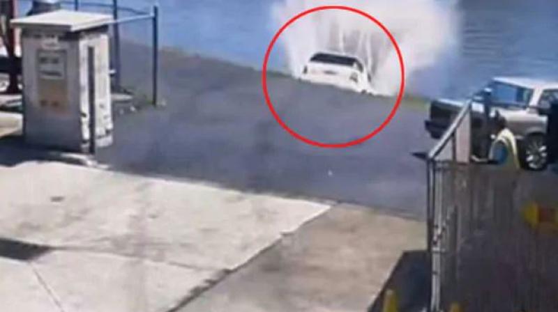 The car was removed from water with the help of a towing company. (Photo: Screengrab) The car was removed from water with the help of a towing company. (Photo: Screengrab)