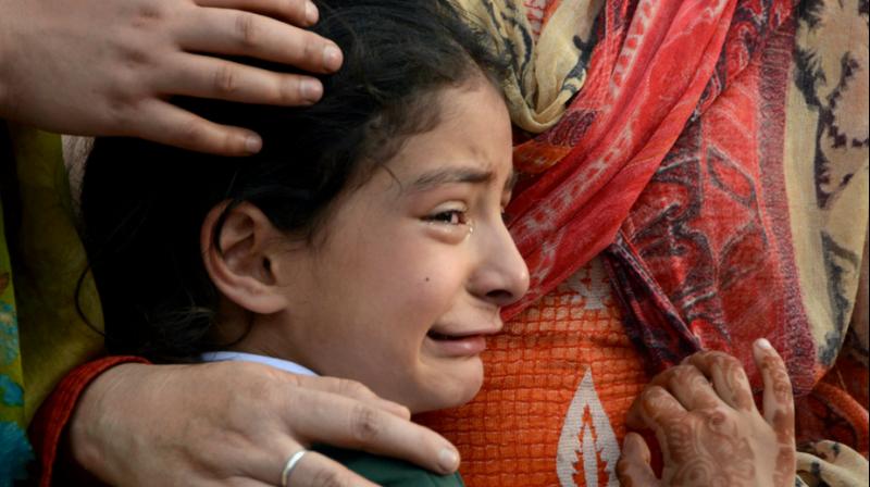 Zohra, daughter of deceased police officer Abdul Rasheed, who was killed in a shootout with suspected rebels, during the funeral at the police headquarters in Srinagar on Monday. (Photo: PTI) Zohra, daughter of deceased police officer Abdul Rasheed, who was killed in a shootout with suspected rebels, during the funeral at the police headquarters in Srinagar on Monday. (Photo: PTI)