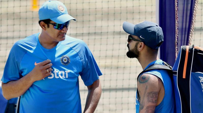Even if there was any discomfort between the reportedly 'warring duo' of Virat Kohli and Anil Kumble, it was not evident in their body language during the session. (Photo: PTI) Even if there was any discomfort between the reportedly 'warring duo' of Virat Kohli and Anil Kumble, it was not evident in their body language during the session. (Photo: PTI)