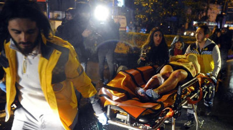 Medics carry a wounded person at the scene after an attack at a popular nightclub in Istanbul on Sunday. (Photo: AP) Medics carry a wounded person at the scene after an attack at a popular nightclub in Istanbul on Sunday. (Photo: AP)